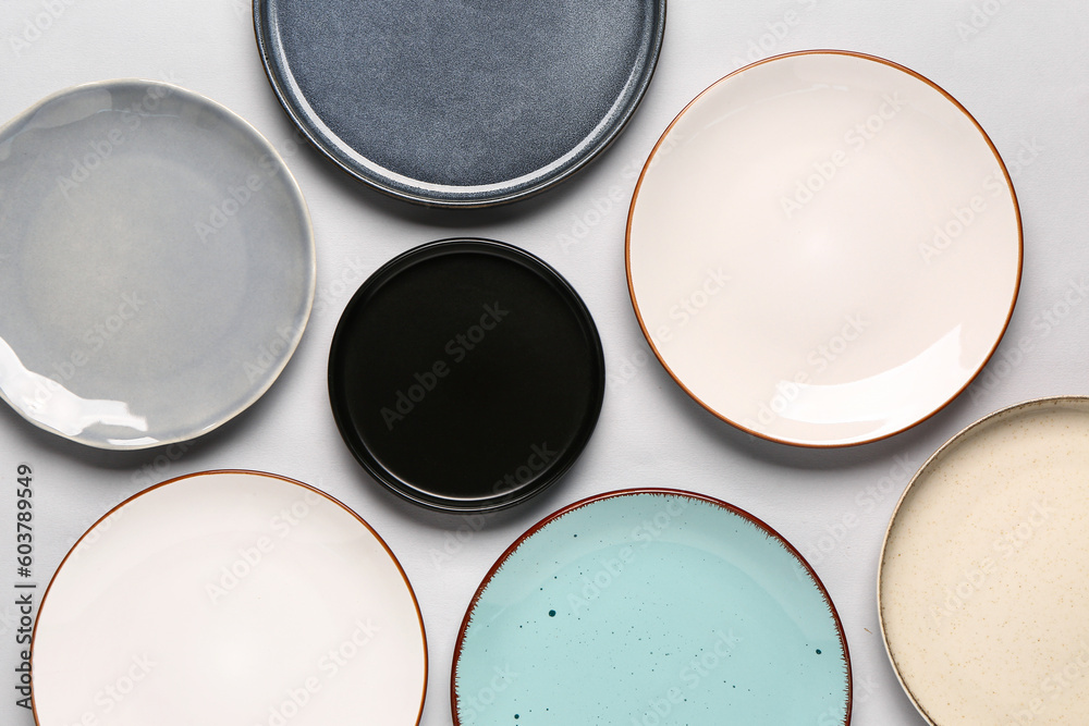 Composition with different clean plates on grey background