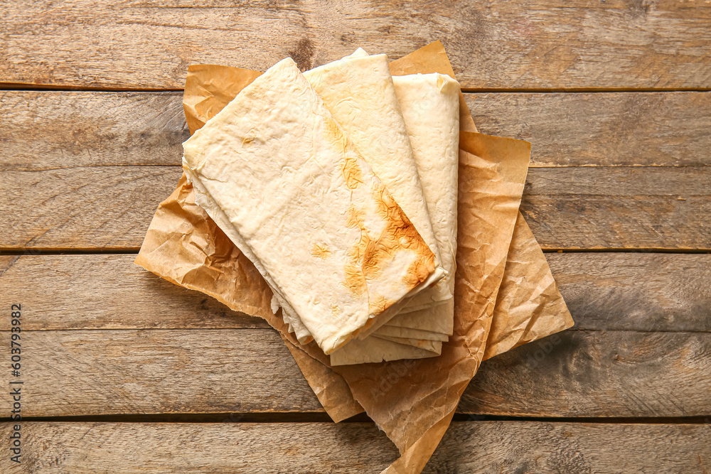 Fresh lavash on wooden background