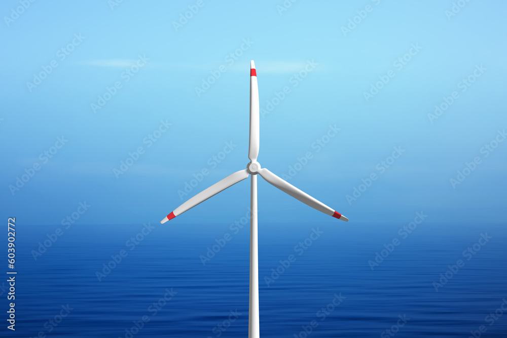 Wind turbine on the ocean with blue sky copy space background. 