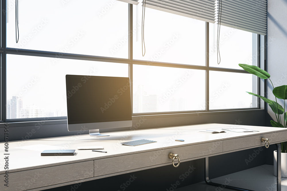 Modern office interior with panoramic windows and city view, blinds, empty mock up computer screen, 