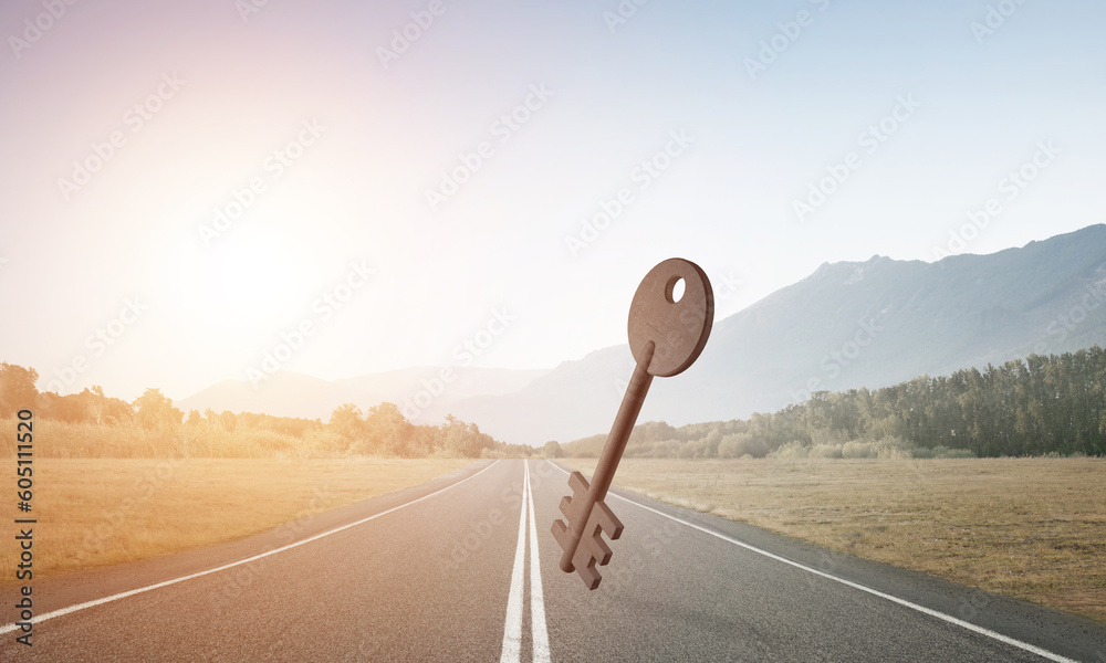 Conceptual background image of concrete key sign on asphalt road