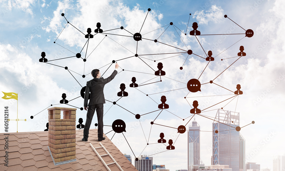 Businessman on house roof presenting networking and connection concept. Mixed media