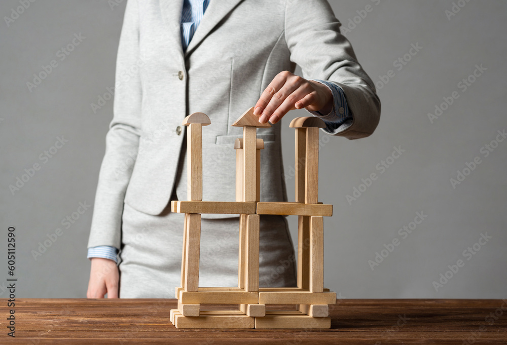 Business woman building construction on table