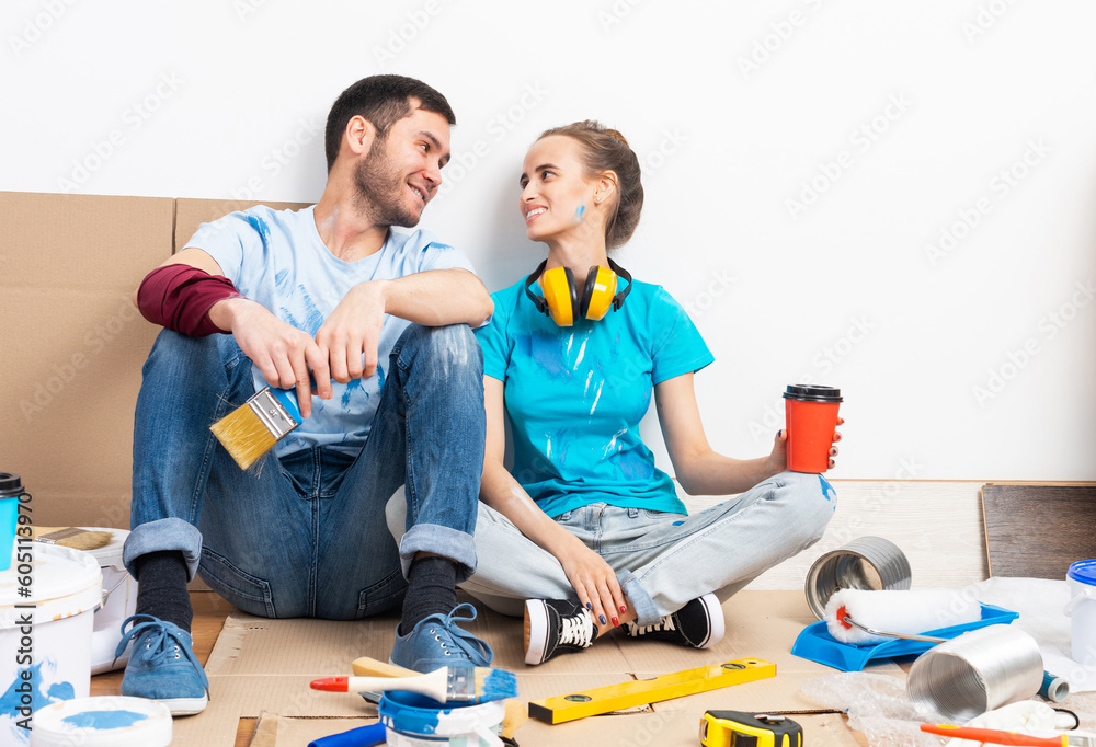 Happy smiling couple relaxing on floor