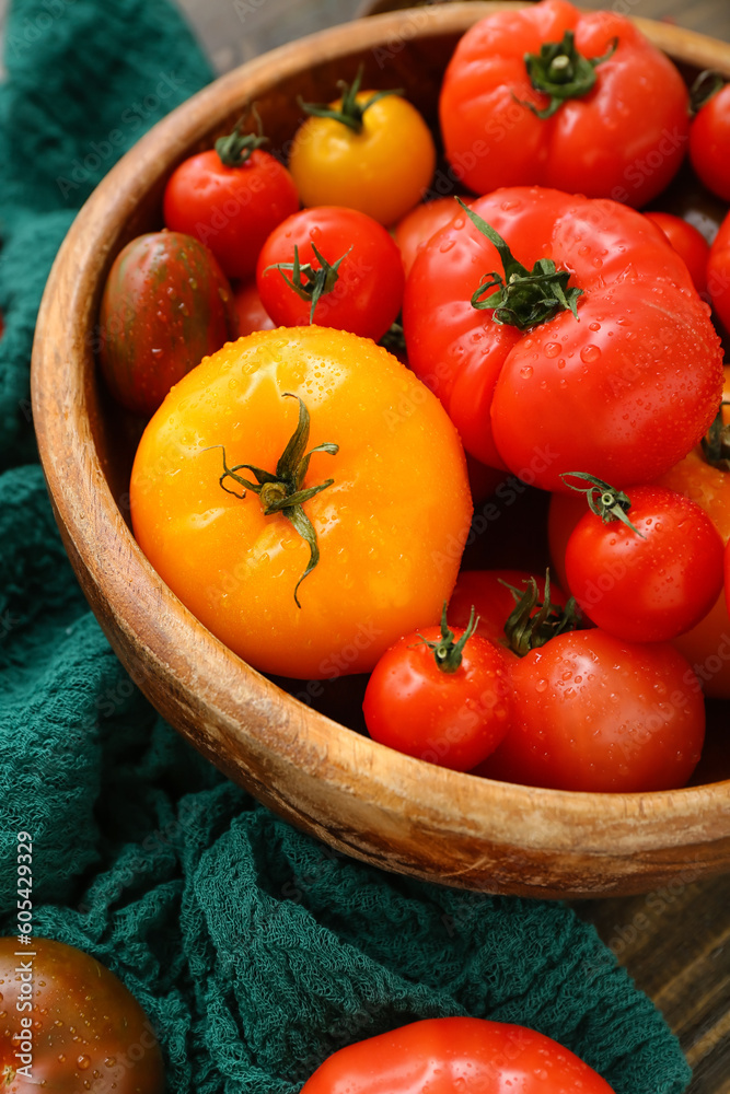 Bowl with different fresh tomatoes, closeup