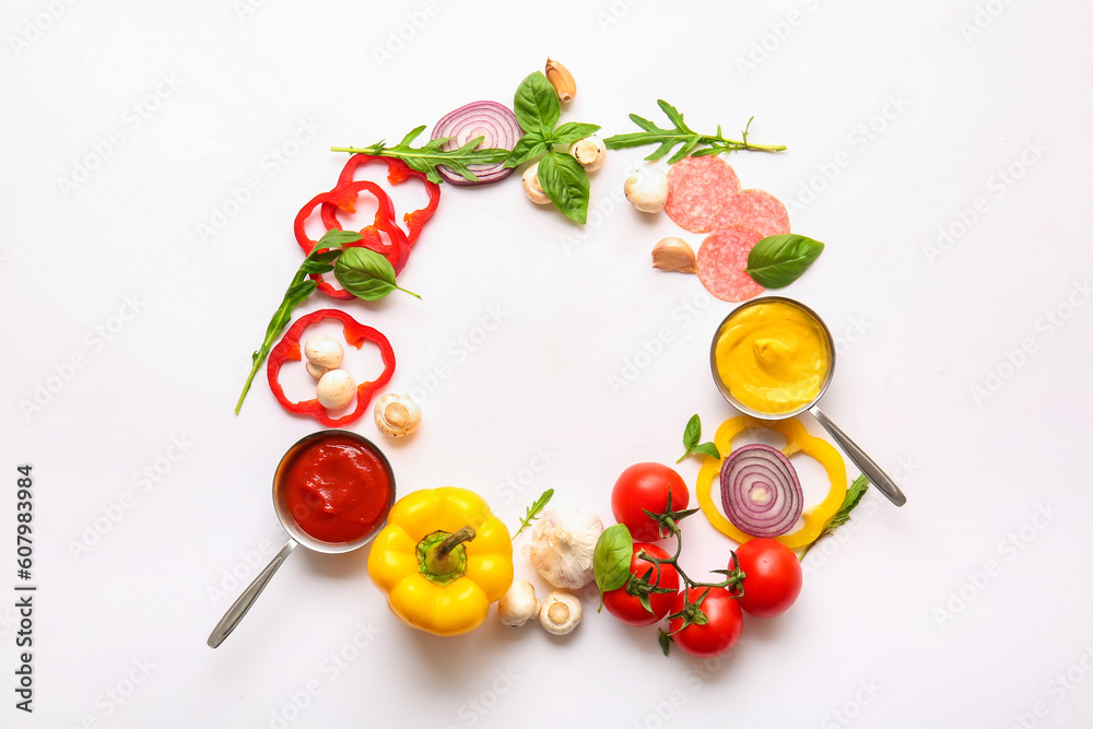 Frame made of ingredients for preparing pizza on white background