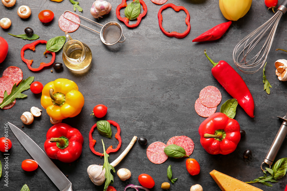 Frame made of ingredients for preparing pizza on black background