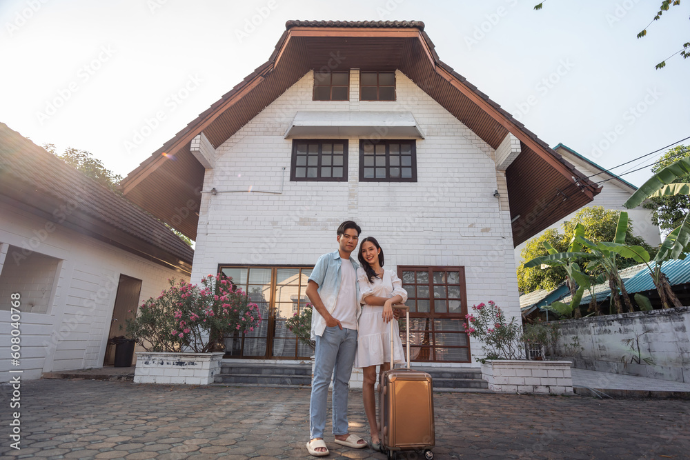 Portrait of Asian young new marriage couple move to new house together. 