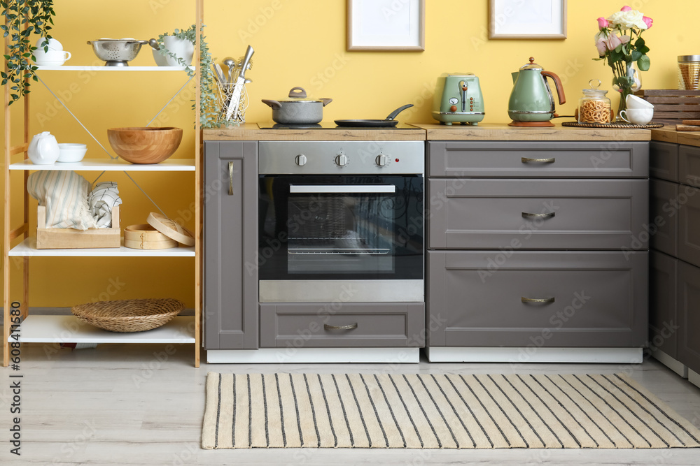 Interior of modern kitchen with stylish rug