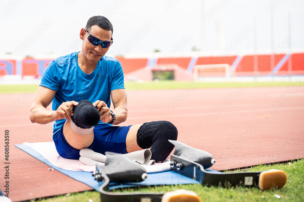 Asian para-athlete disabled wearing prosthetic blades at the stadium