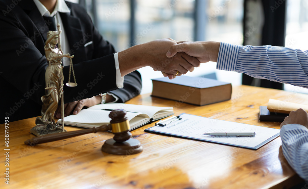 Legal consulting services, legal negotiations, lawyers shake hands with clients after negotiating an