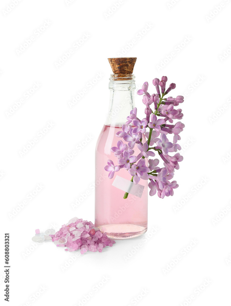 Bottle of cosmetic oil with beautiful lilac flowers on white background