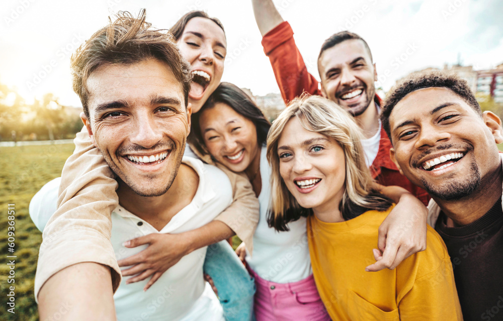 Multiracial friends taking selfie picture with smart mobile phone outside - Group of young people sm