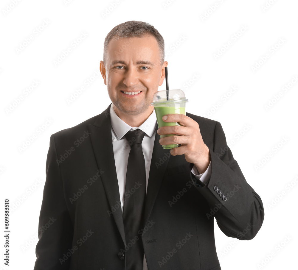 Mature businessman with glass of vegetable smoothie on white background