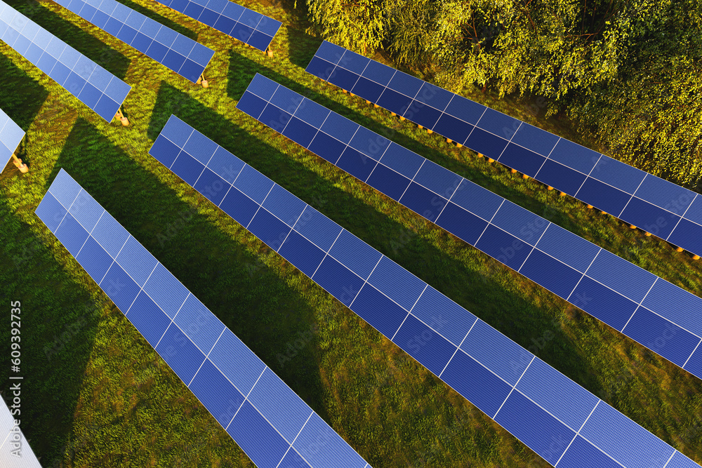 Solar panels aerial view among green trees in the forest at sunset