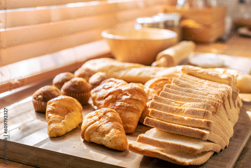 Close up of many types of delicious fresh bread in the kitchen room. 