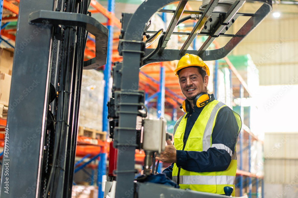 Portrait of Caucasian industrial worker working in manufacturing plant. 