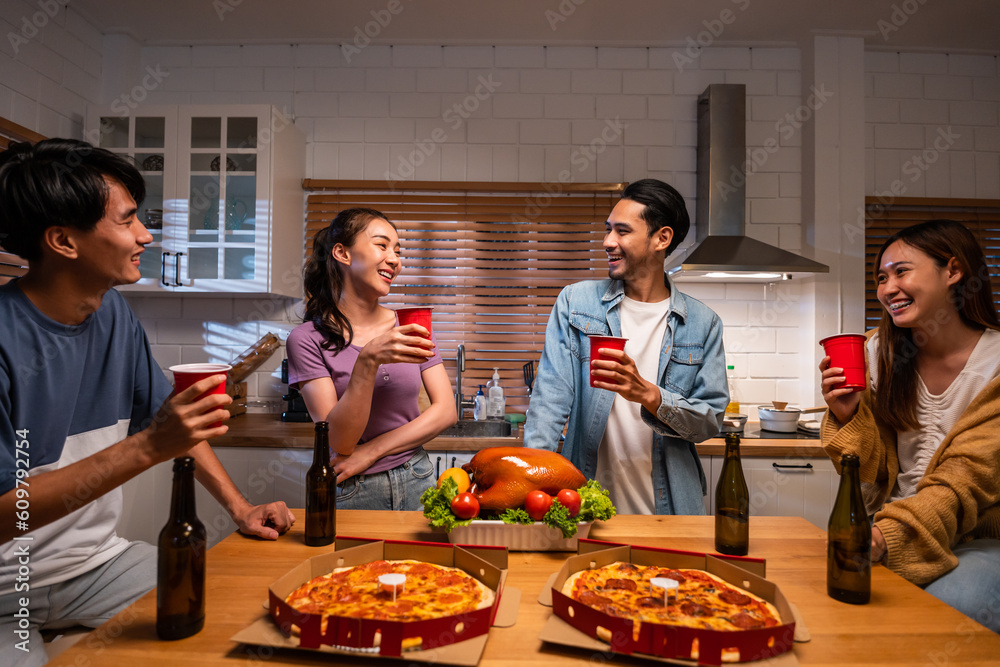 Group of Asian friend having dinner, enjoy evening party together at home. 