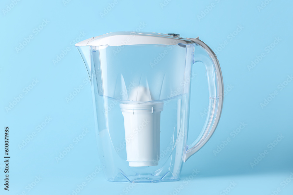 Water filter jug on blue background