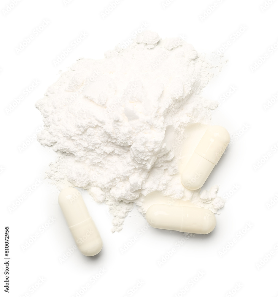 Amino acid pills and powder on white background