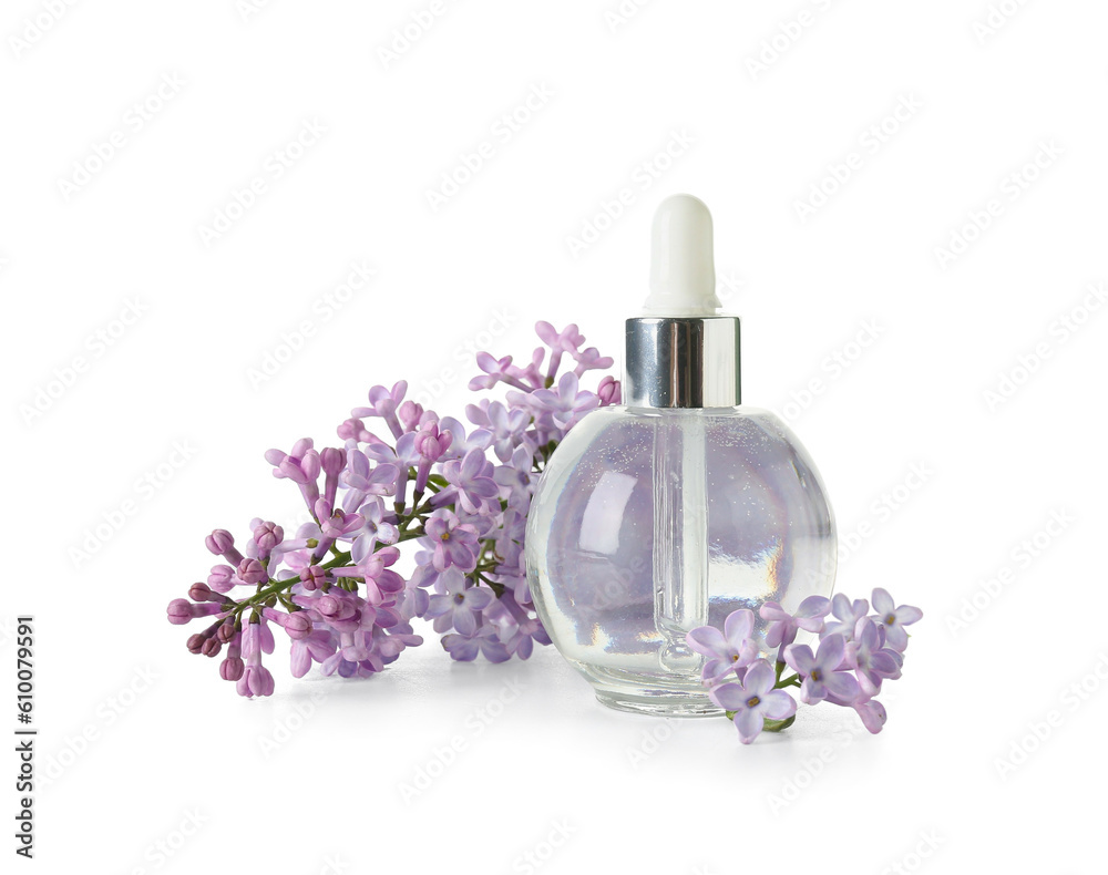 Bottle of cosmetic oil with beautiful lilac flowers on white background