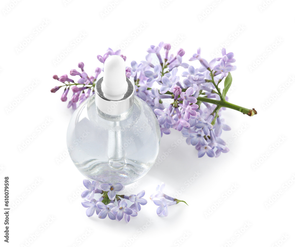 Bottle of cosmetic oil with beautiful lilac flowers on white background