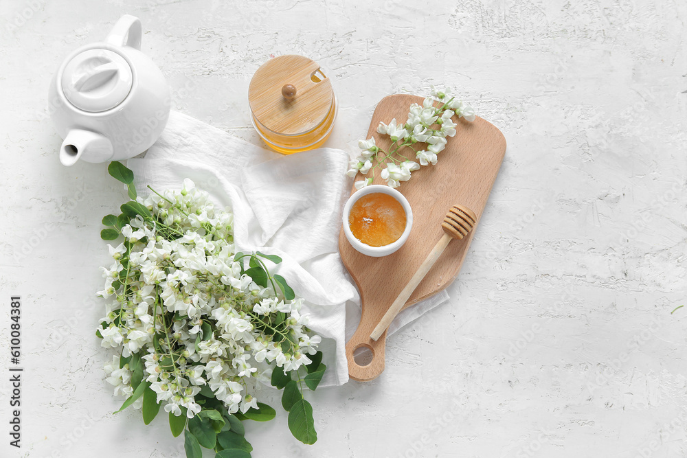 Composition with sweet honey and acacia flowers on light background