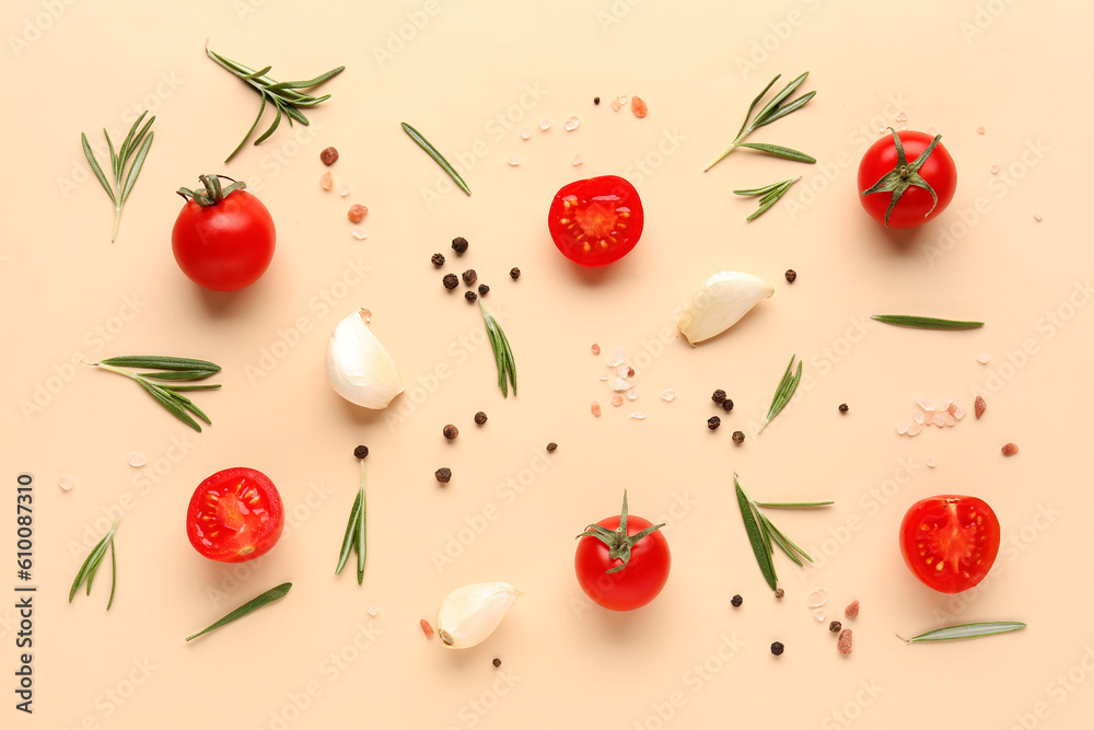 Composition with ripe cherry tomatoes and spices on beige background