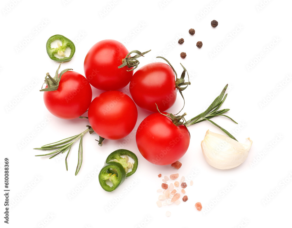 Composition with ripe cherry tomatoes, jalapeno and spices on white background