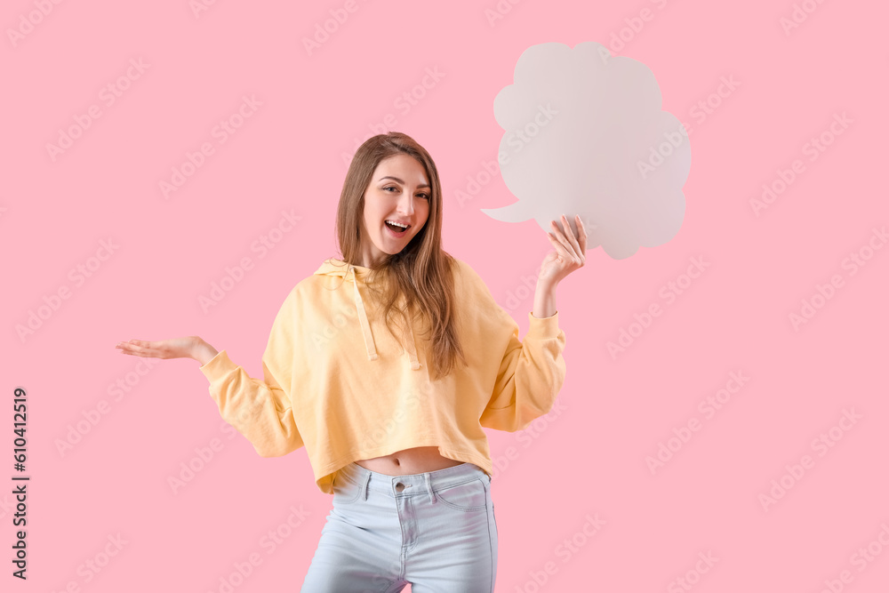 Young woman with blank speech bubble on pink background