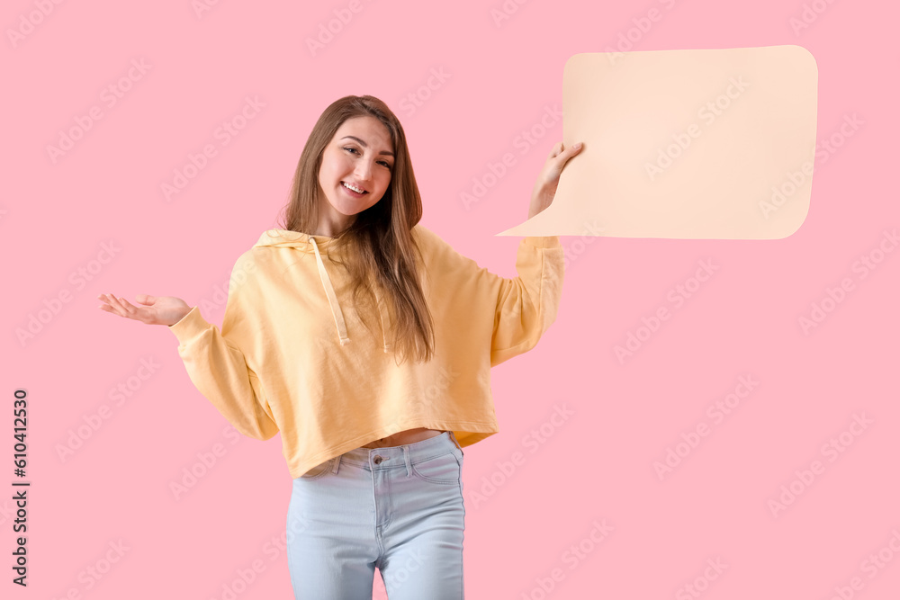 Young woman with blank speech bubble on pink background