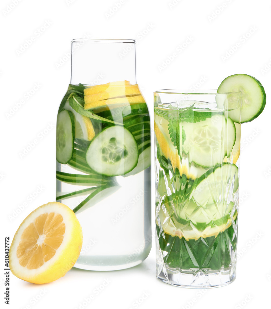 Glass and bottle of infused water with cucumber slices on white background