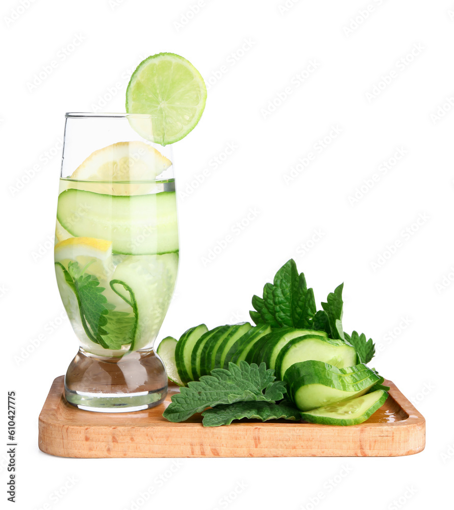 Board and glass of infused water with cucumber slices on white background