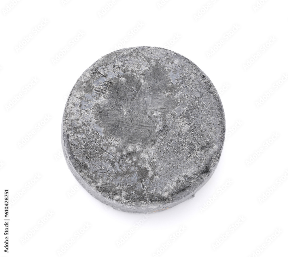 Grey solid shampoo bar on white background