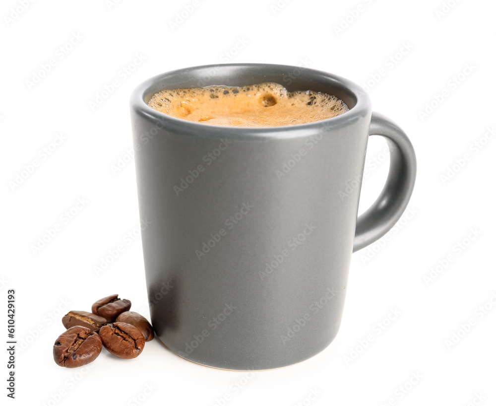 Cup of delicious espresso  with coffee beans on white background