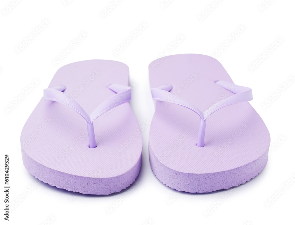 Pair of stylish lilac flip-flops on white background