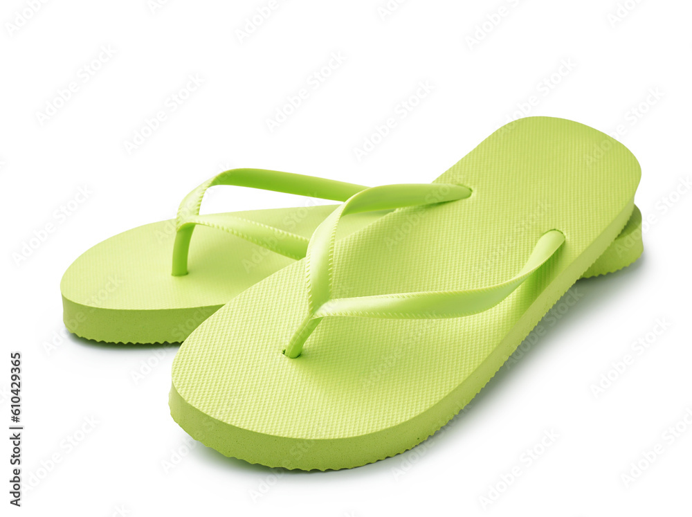 Pair of stylish green flip-flops on white background