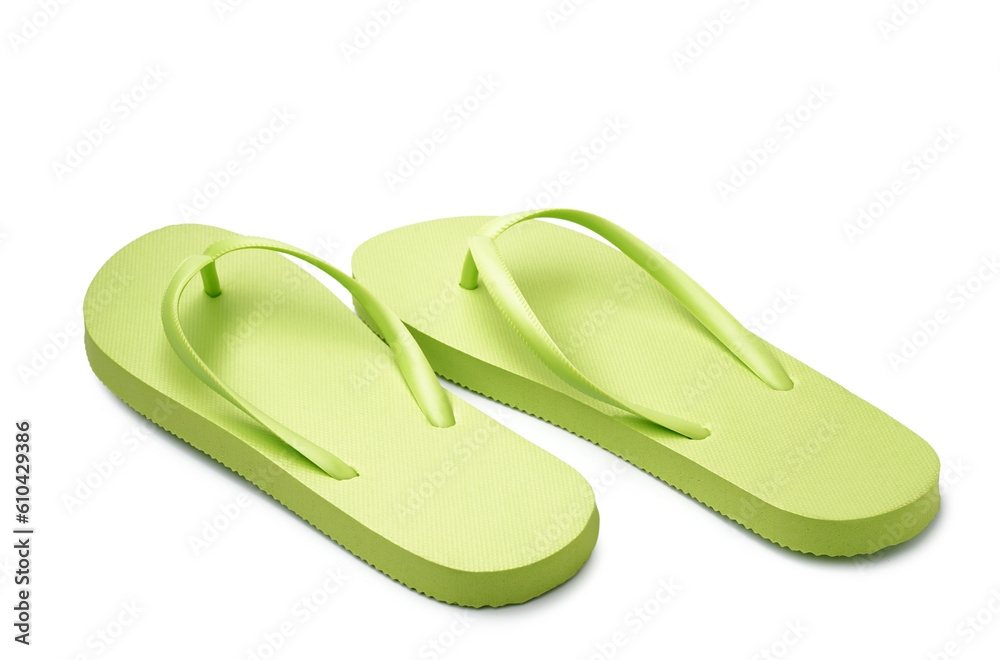 Pair of stylish green flip-flops on white background