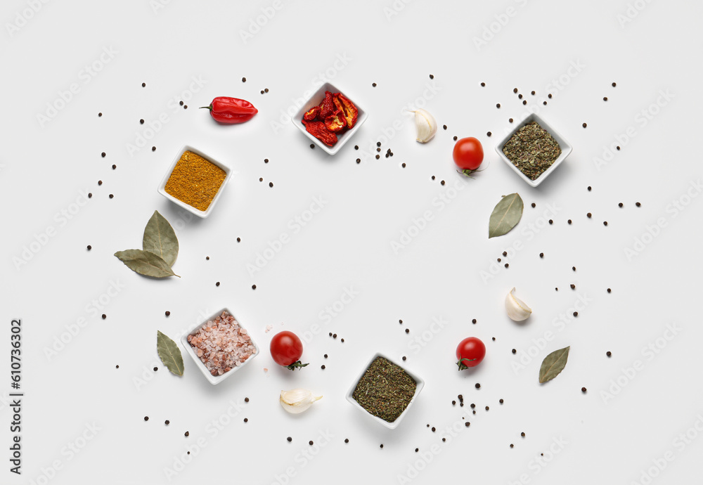 Frame made of fresh spices and vegetables on light background