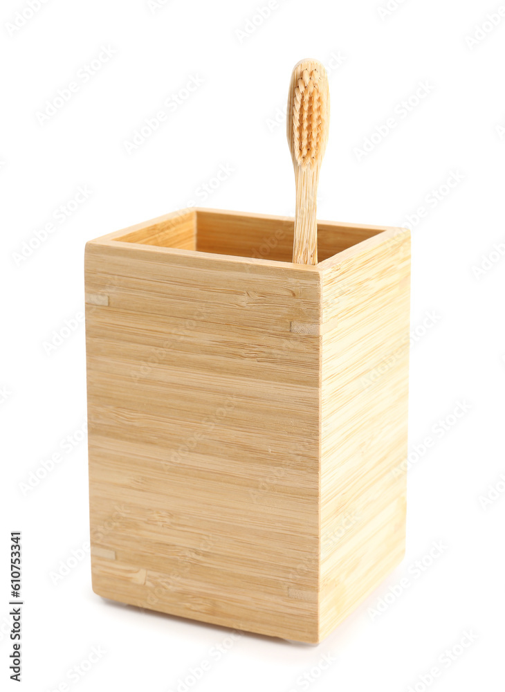 Bamboo tooth brush in holder on white background