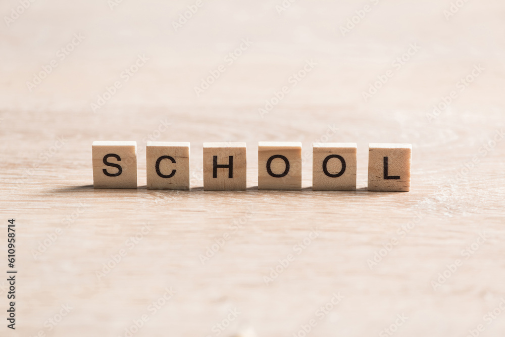 wooden elements with letter collected to word school