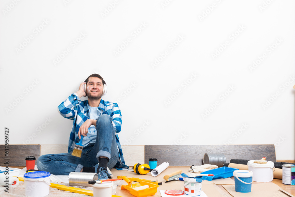 Bearded man listening to music in headphones