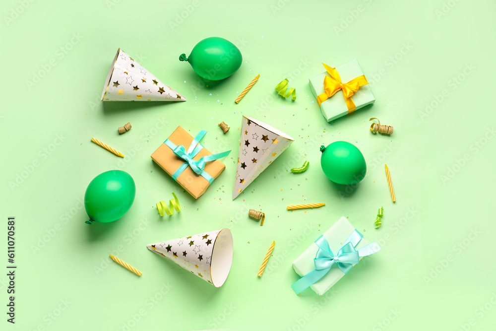 Different party decor on pale green background