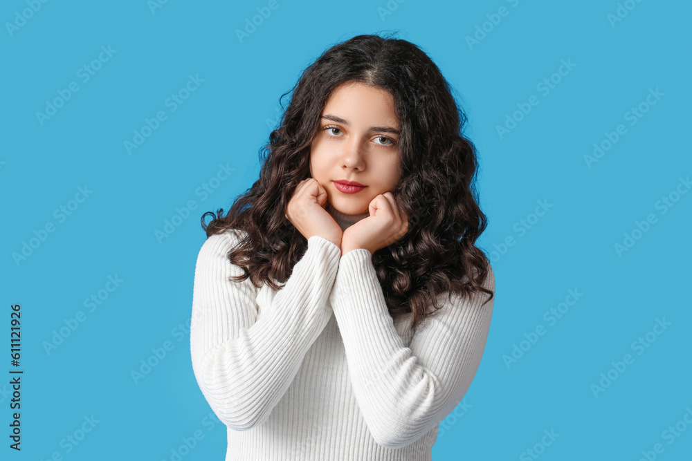 Teenage girl on blue background