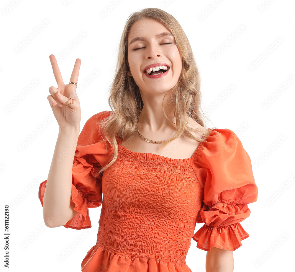 Young woman showing victory gesture on white background