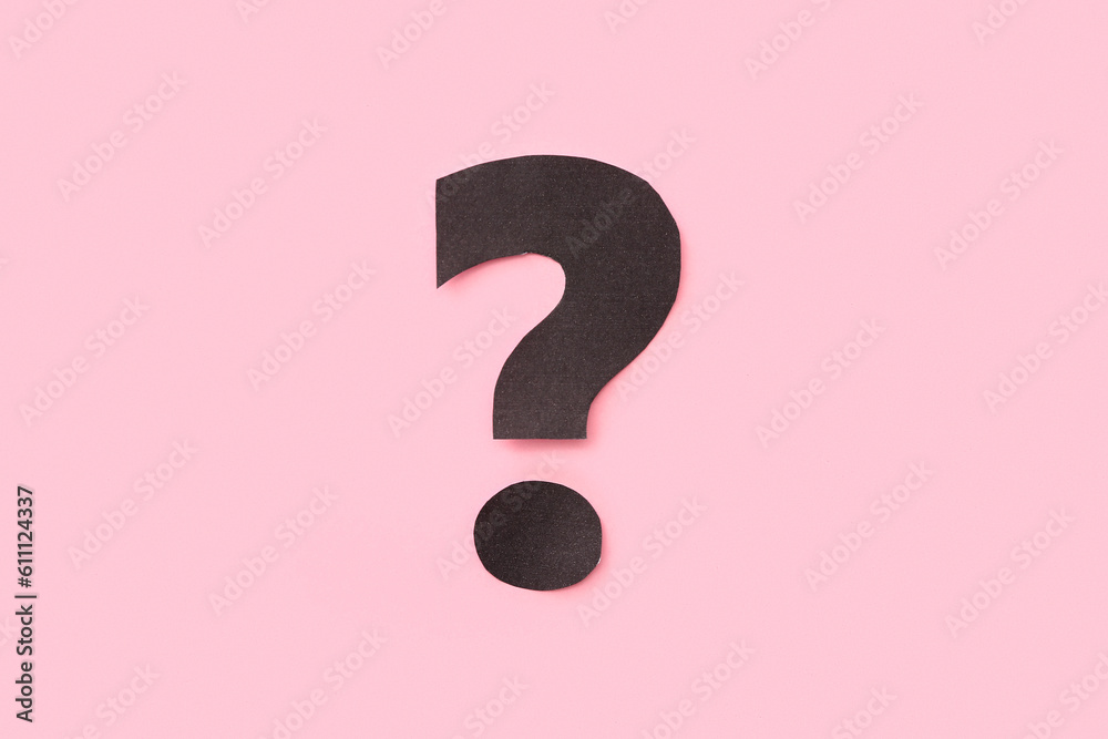 Paper question mark on pink background