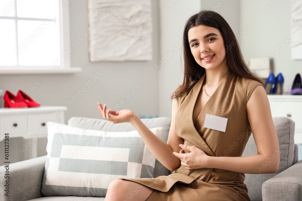 Female sales assistant showing something in boutique