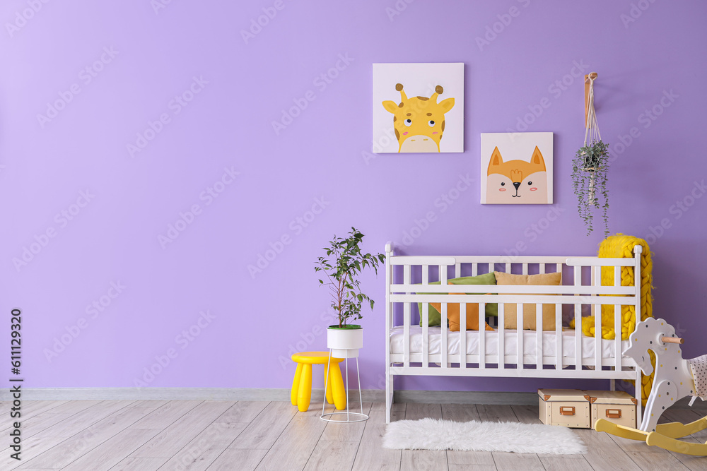 Stylish interior of childrens room with baby bed and rocking horse