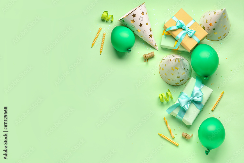 Different party decor on pale green background