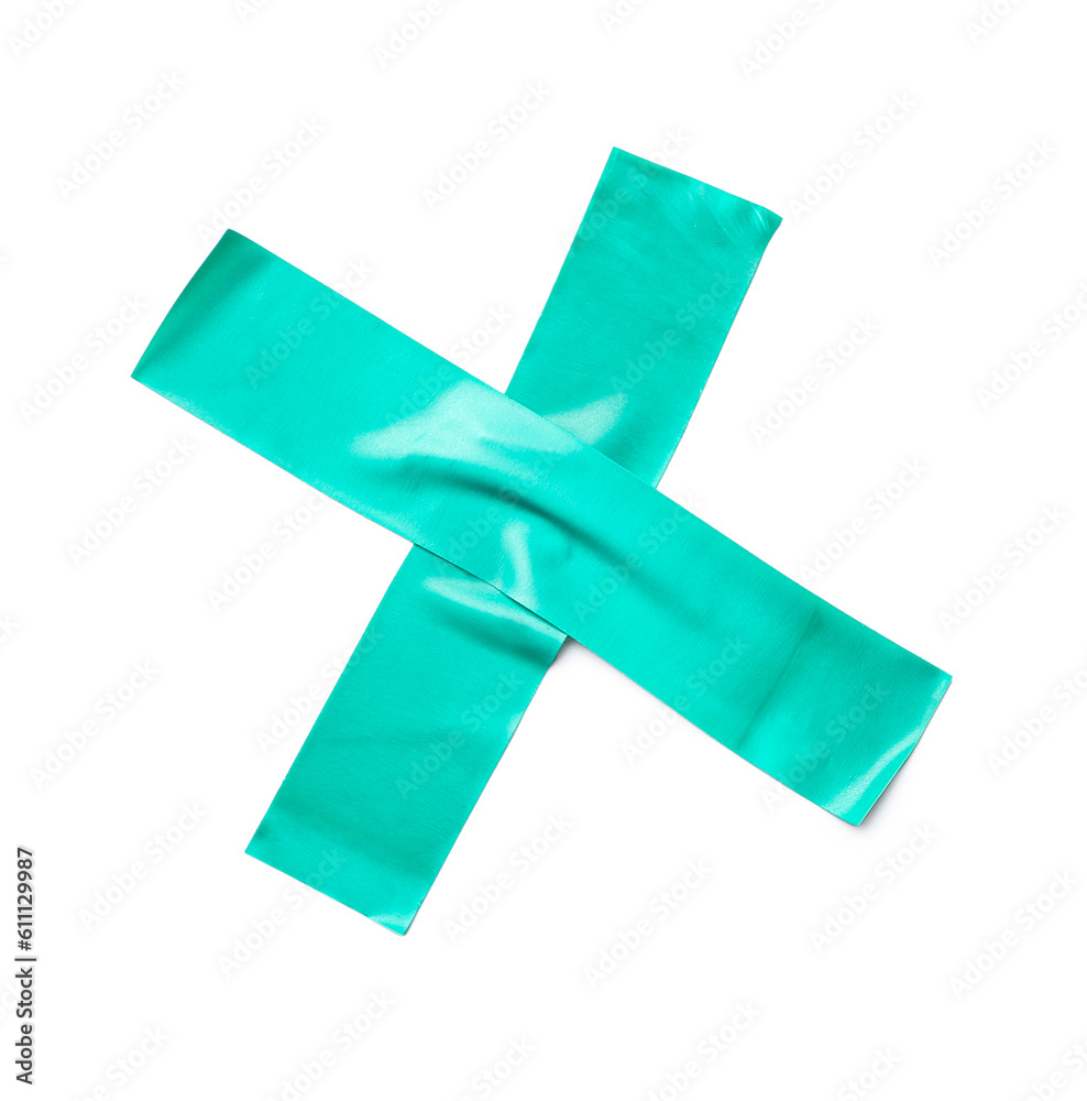 Cross made of adhesive tape on white background